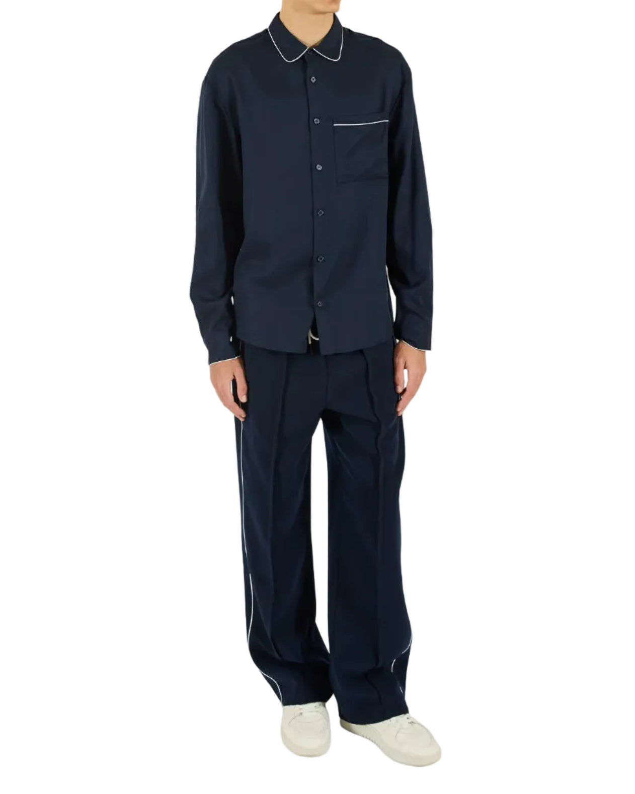 Person wearing a navy long-sleeve shirt and pants on a white background