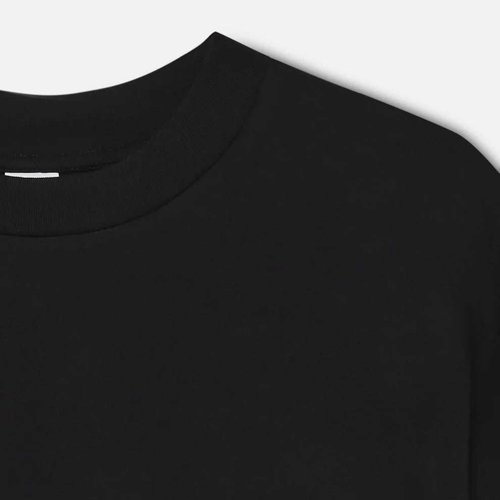 Close-up of a black long-sleeve shirt on a white background