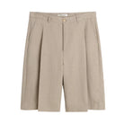 Beige pleated shorts on a white background