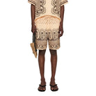 Man wearing a patterned outfit with a white background