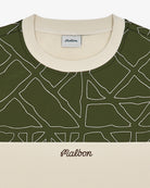 Green patterned shirt with beige collar and Malbon label on a white background