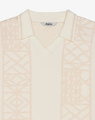 Light pink patterned garment with 'Malbon' label on a white background