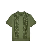 Green t-shirt with geometric pattern on a white background