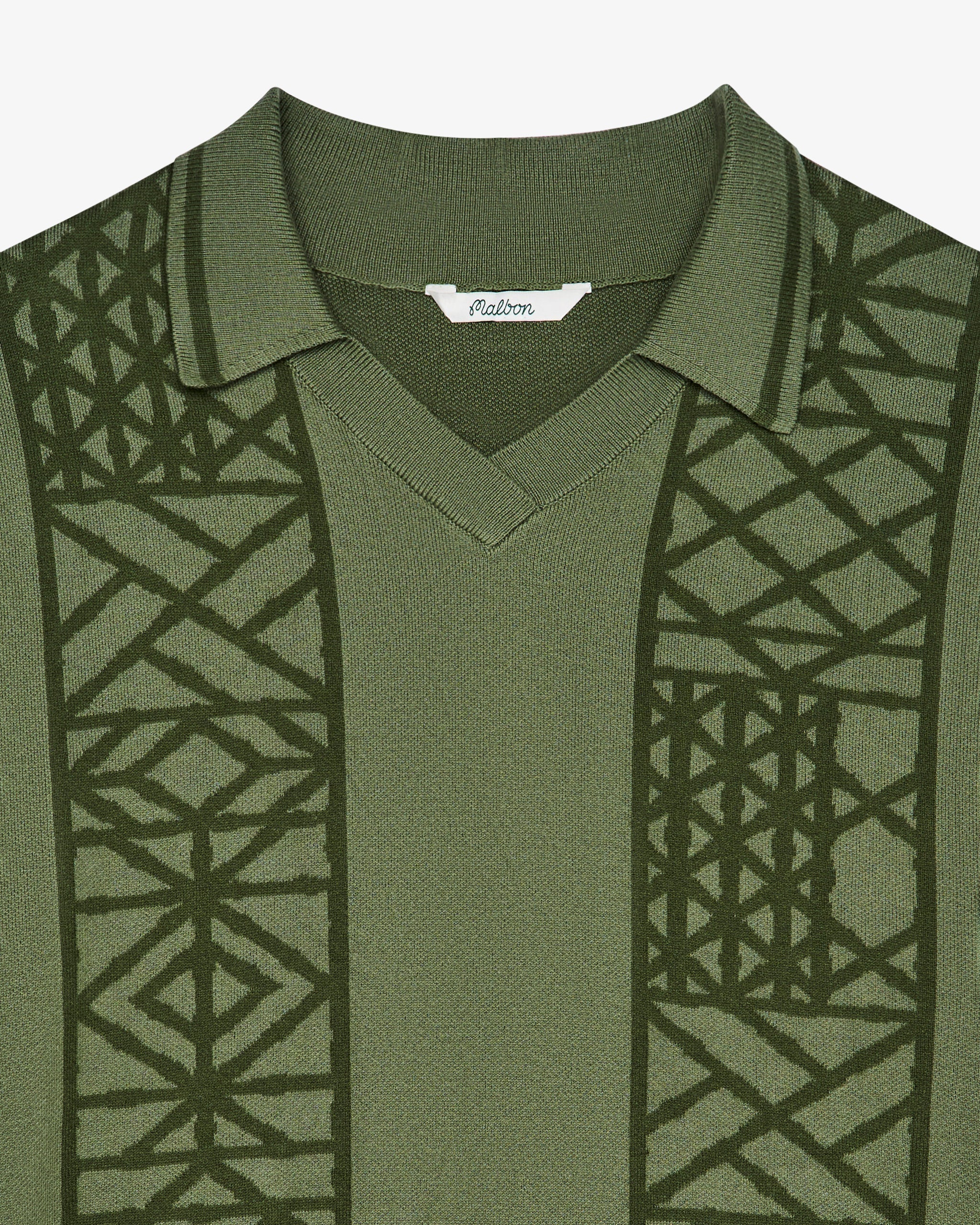 Green patterned shirt with geometric design on a white background