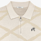 Beige patterned polo shirt with a collar and monogram on a white background