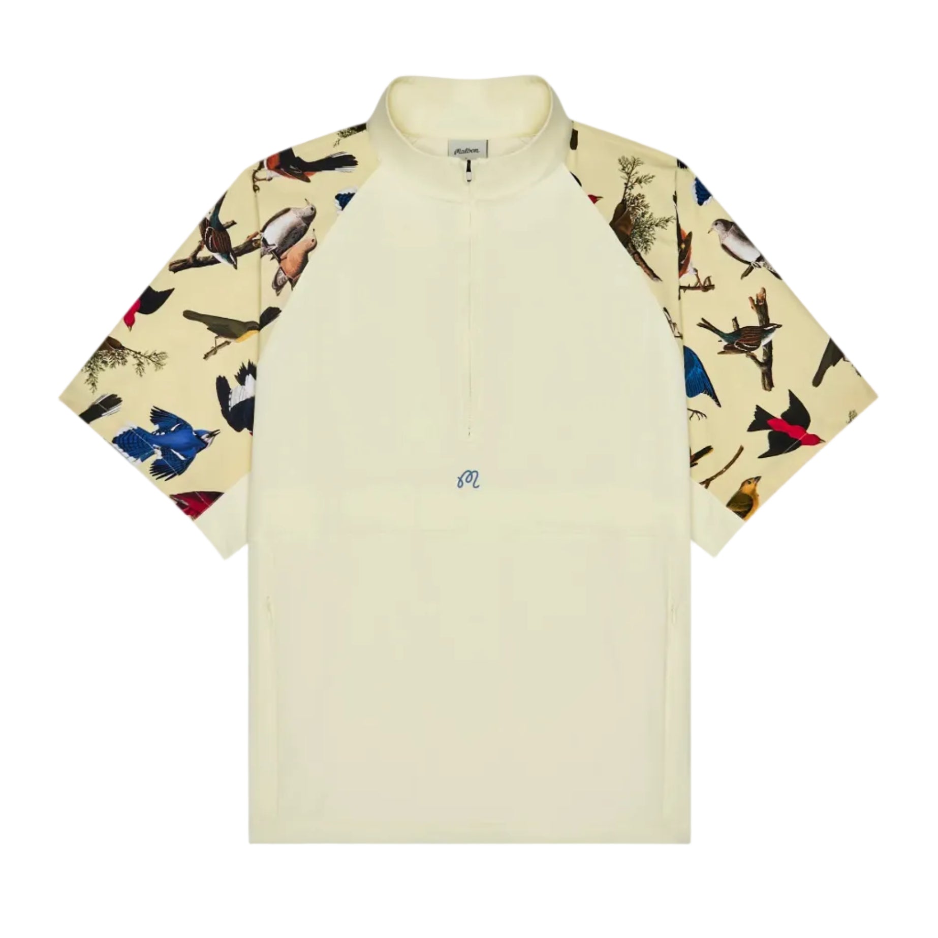 Beige shirt with colorful animal print sleeves on a white background