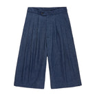 Chambray blue pleated cropped pants on a white background