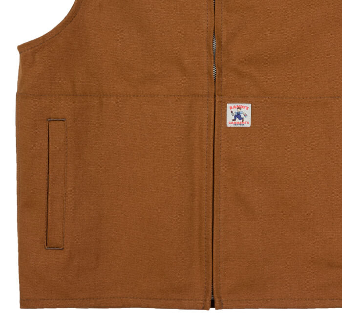 close-up view of a brown vest with a brand logo on a white background