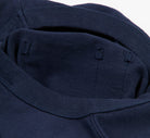Close-up of a navy blue t-shirt with a focus on the collar.
