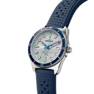 Shinola watch with blue strap and silver case on a white background