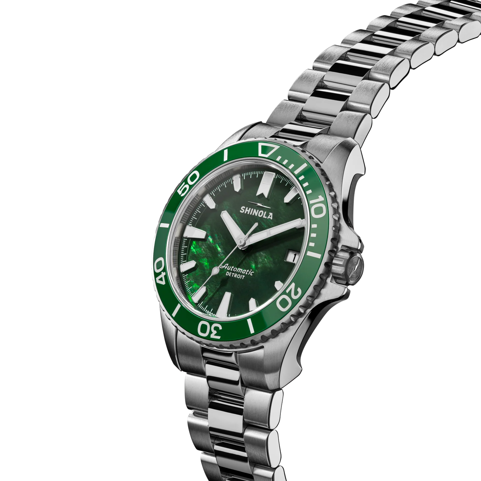 Shinola watch with green face and silver metal band on white background