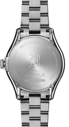 Back of a silver analog watch on a white background