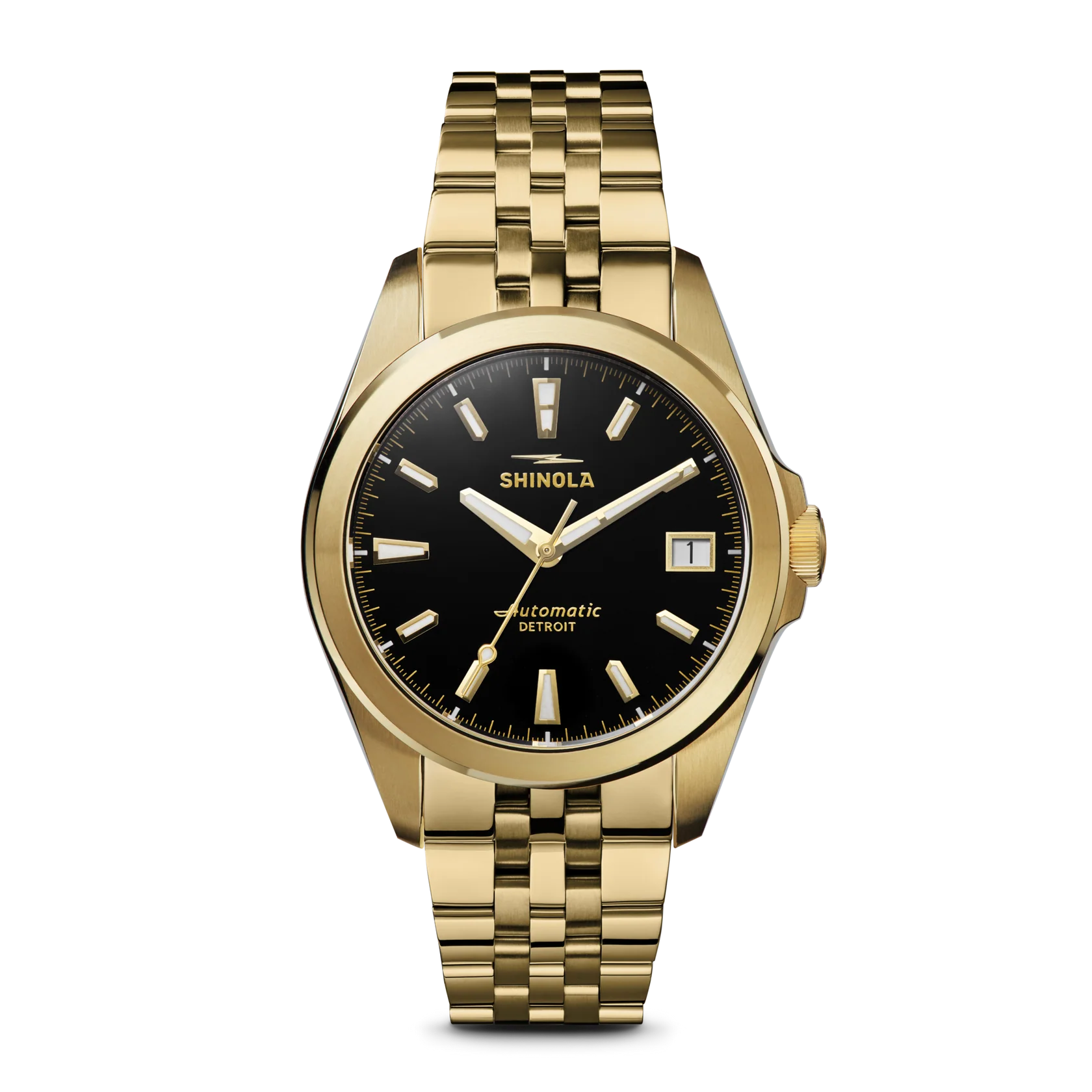 Shinola watch with gold bracelet and black dial on a white background