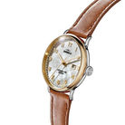 Shinola watch with brown leather strap and gold casing on white background