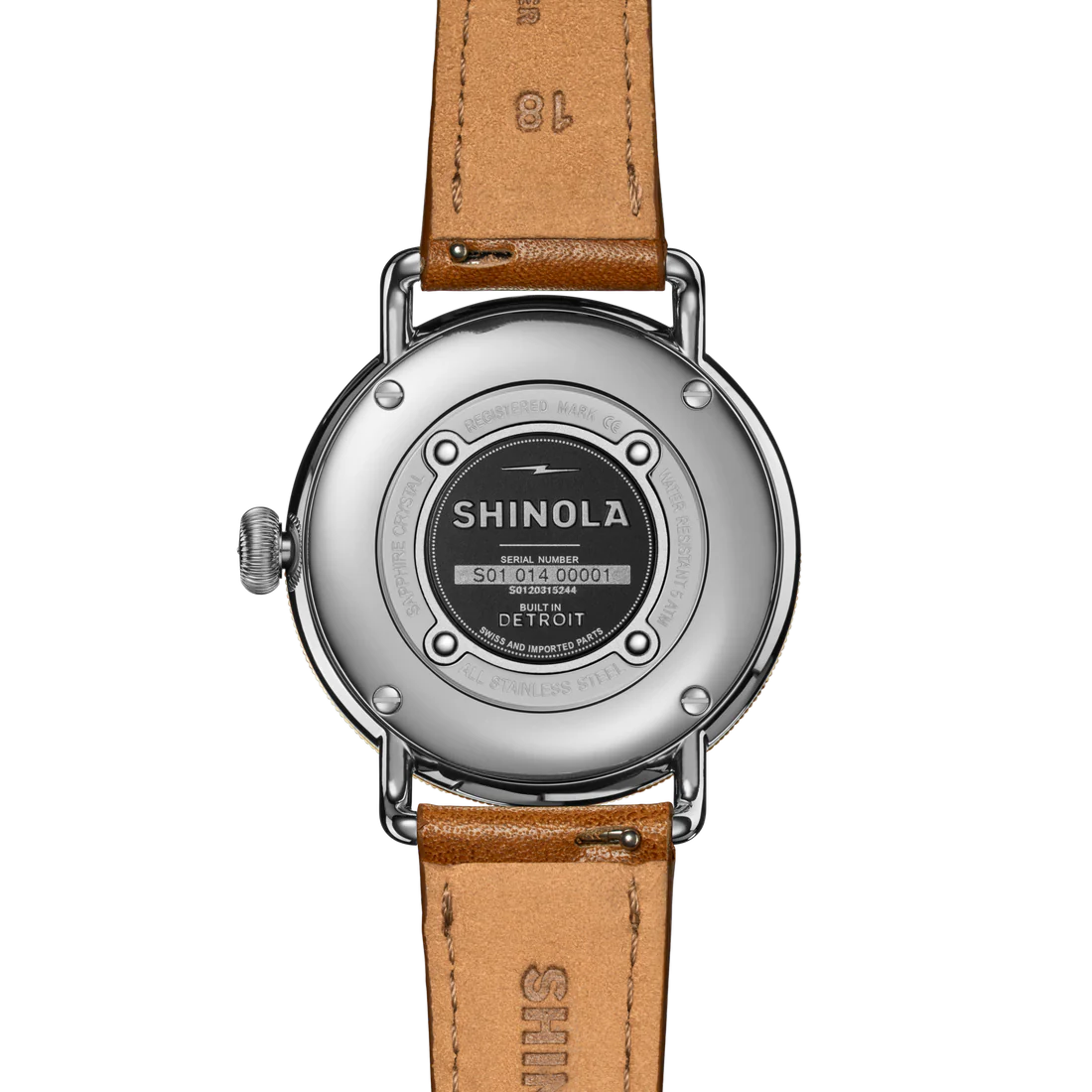 Silver back of watch with a tan band on a white background