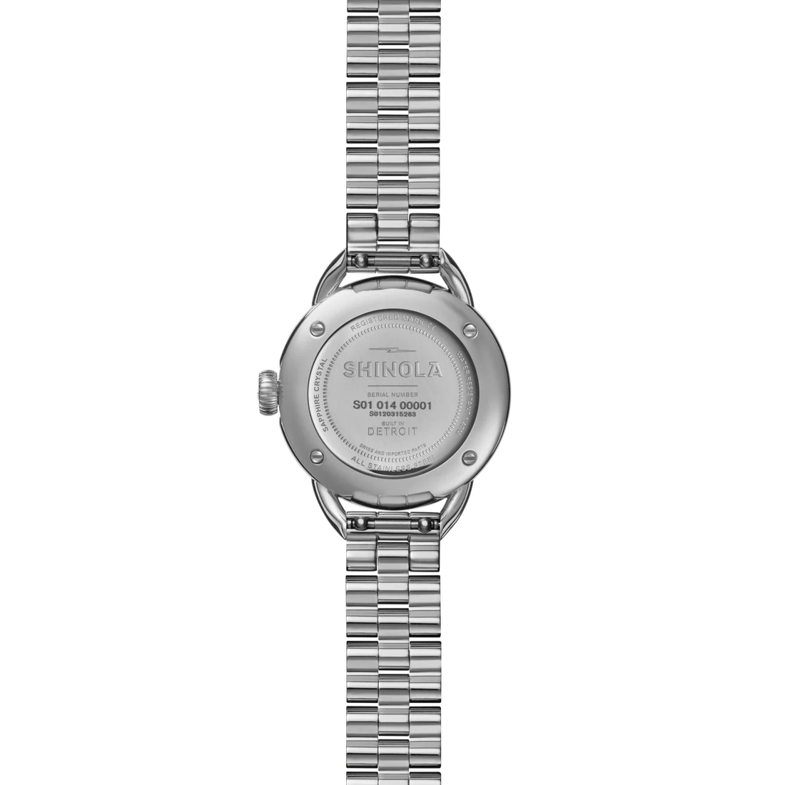 Back of a silver Shinola watch on a white background