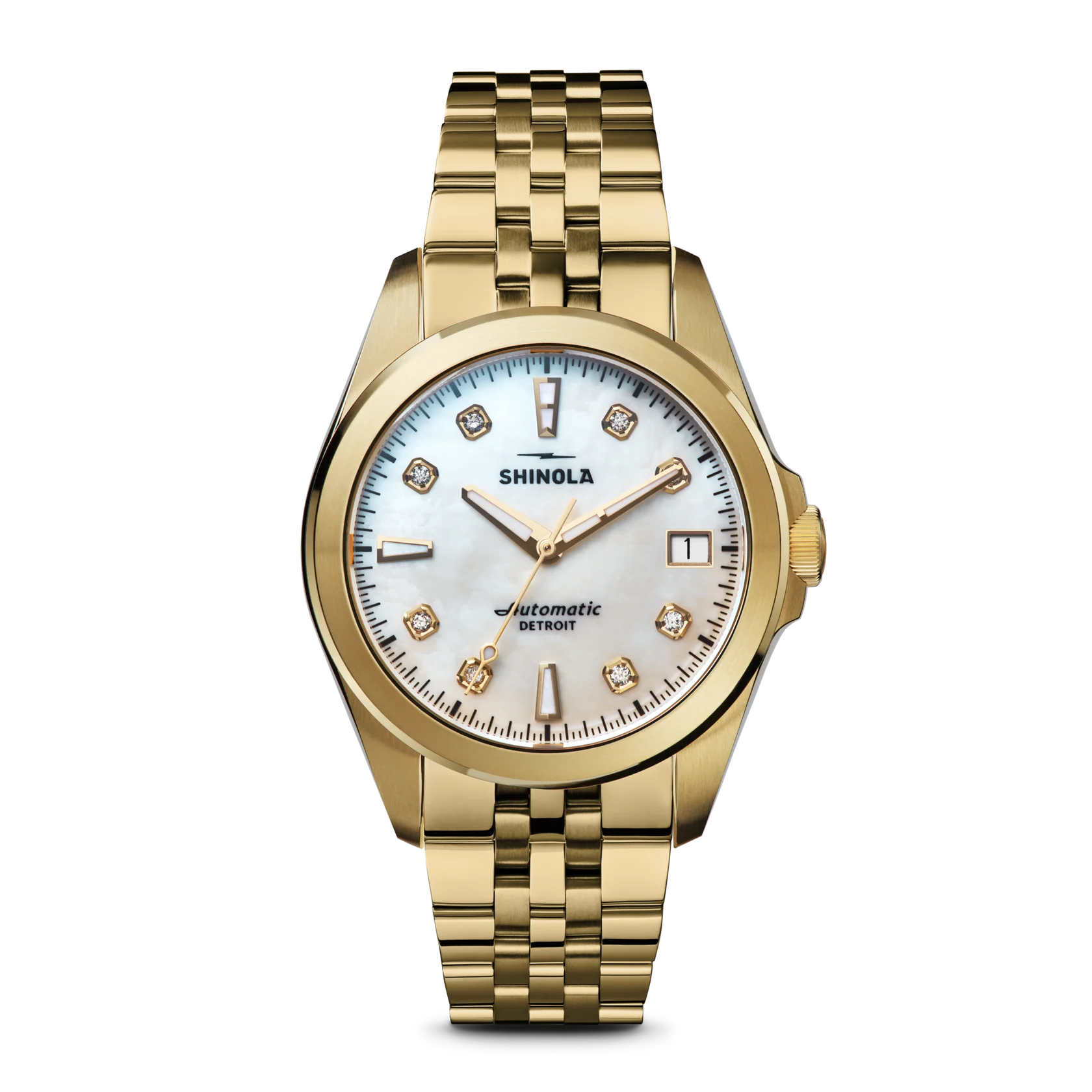 Gold Shinola watch with a white face on a white background