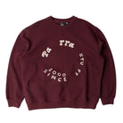 Maroon sweatshirt with white text on a light gray background