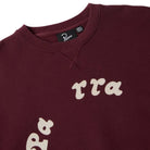 Maroon sweatshirt with white text on a white background