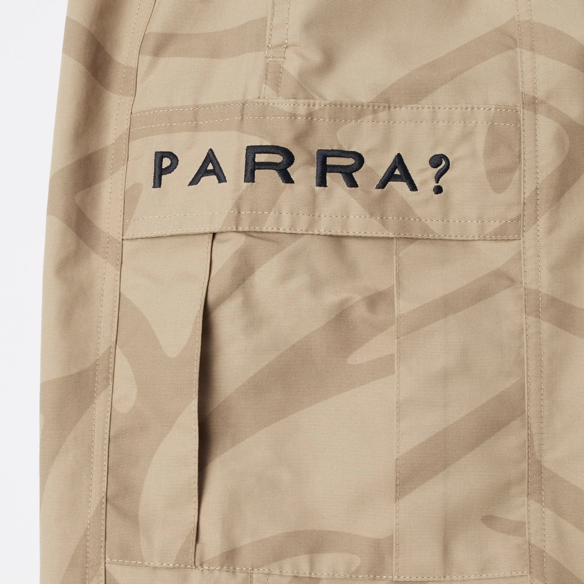 Beige cargo pocket with 'PARRA?' logo on a white background