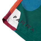 Close-up of a colorful garment with 'PARRA' branding on a white background