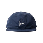 Navy blue cap with a white logo on a light gray background