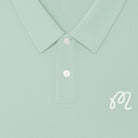 Light green shirt collar with buttons and a brand logo on a light green background