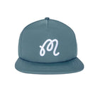 Blue cap with a white label on a white background