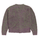 Purple and green textured sweater on a white background