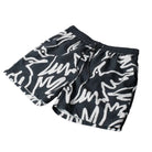 Black board shorts with an allover bird print in white on a white background