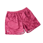 Pink swim shorts on a white background