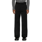 Person wearing a gray dress shirt and black pants on a white background