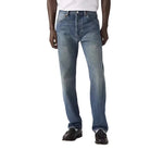 Person wearing blue jeans and a white shirt on a plain background