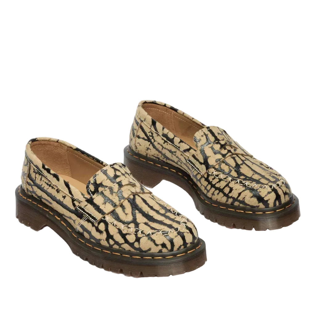 Pair of patterned loafers on a light gray background