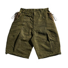Green shorts with drawstring on a white background