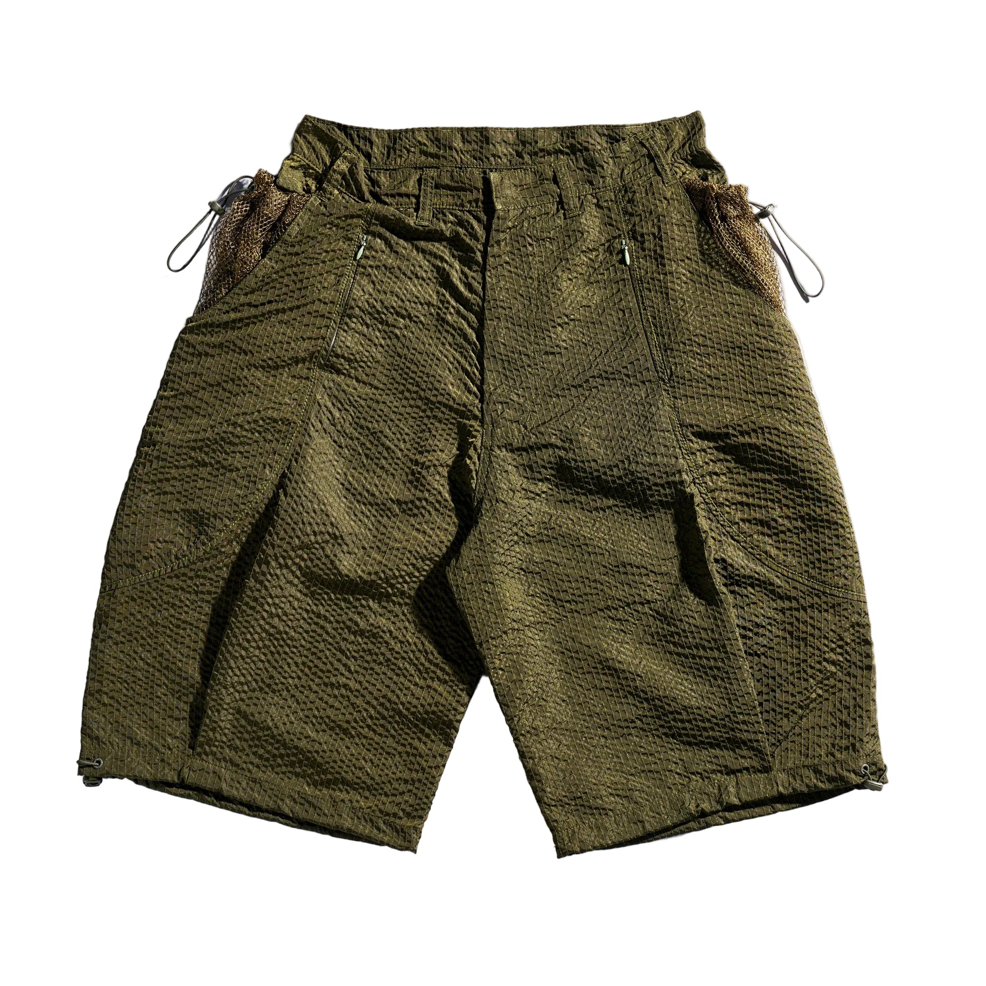Green shorts with drawstring on a white background
