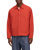 Person wearing a red jacket and blue pants on a white background