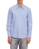 Man wearing a blue checkered shirt against a white background