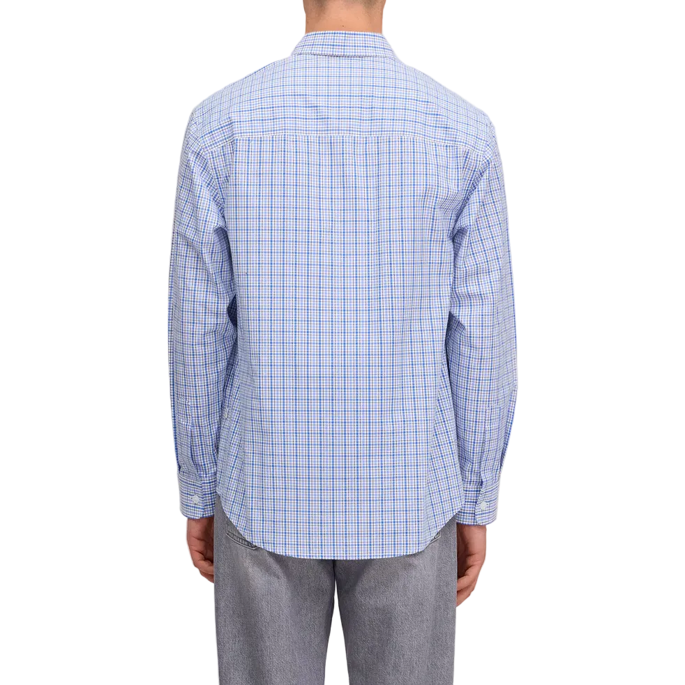 Man wearing a blue checkered shirt and gray pants on a white background