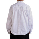 White shirt worn by a person on a white background