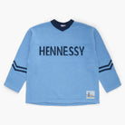 Blue sweater with 'Hennessy' knit on the front on a white background