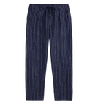 Navy blue striped pants on a white background