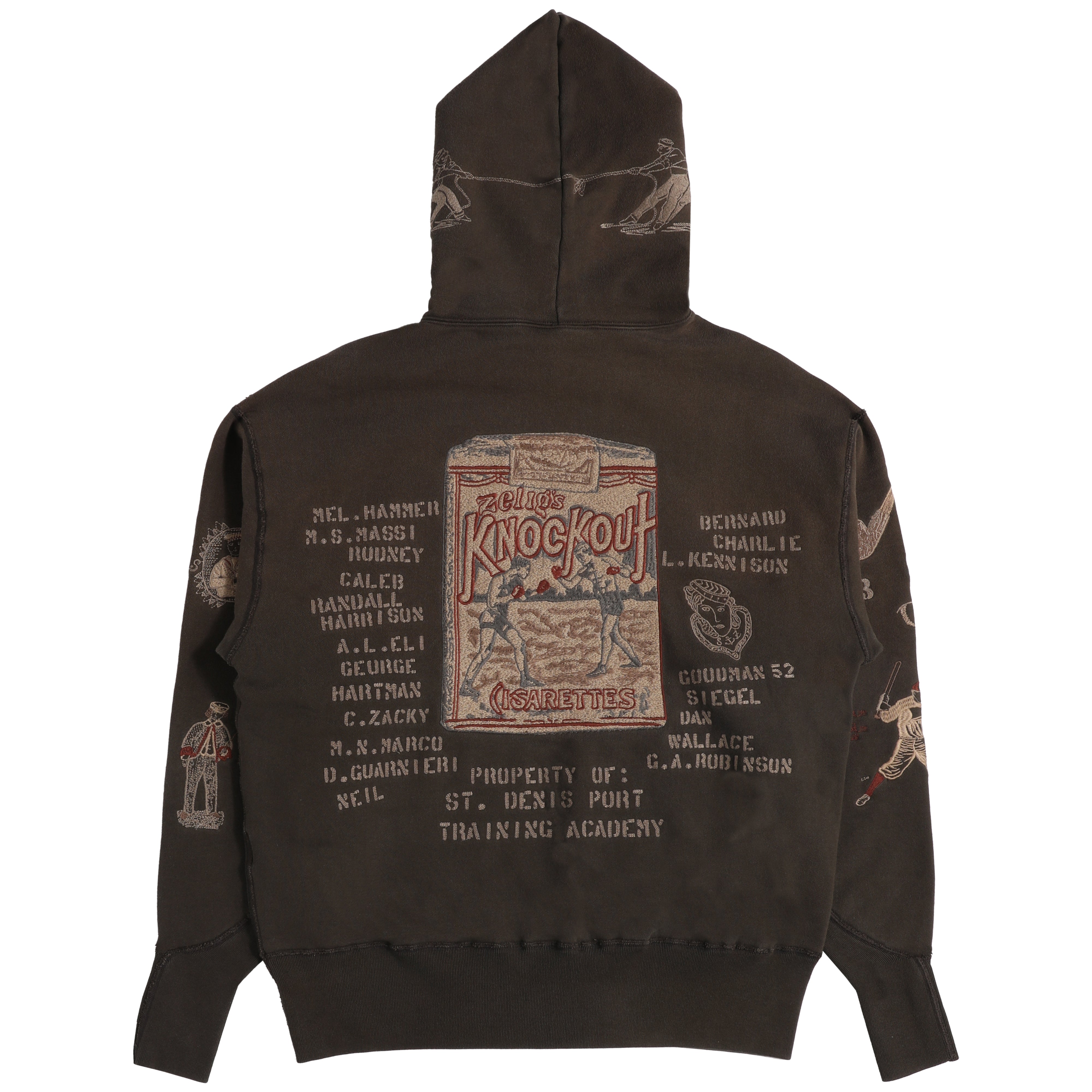 The back of a dark brown hooded sweatshirt featuring a large vintage-style 'Zelig's Knockout' boxing graphic in the center, surrounded by various text elements and illustrations in beige and muted red.