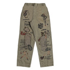 A pair of beige cargo pants featuring vintage pin-up girl illustrations and retro text graphics printed all over the fabric, shown against a plain white background.