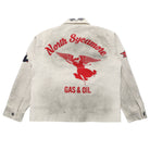 A light beige, heavily distressed jacket shown from the back, featuring a large red vintage-style 'North Sycamore Gas & Oil' winged figure logo printed on the back.