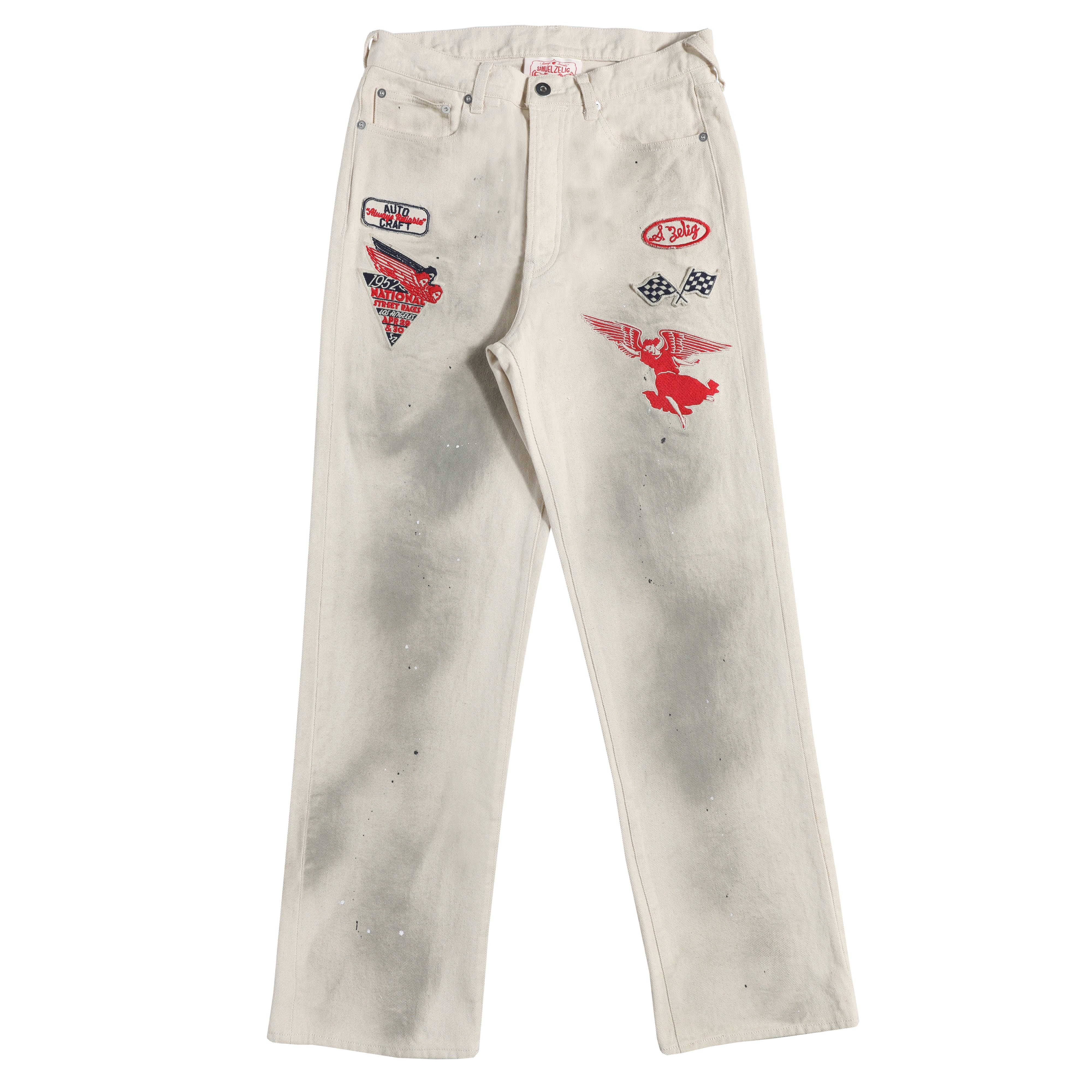 Off-white jeans featuring a distressed, faded wash and decorated with red and black graphic patches on the thighs, shown against a plain white background.