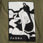 Green t-shirt with a black and white graphic design and 'PARRA' branding.