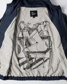 A navy blue zip-up jacket with a beige inner lining featuring a large black line-art graphic of a seated figure. The brand label 'Parra' is visible inside the collar.