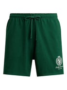Green shorts with a brand logo on a white background