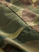 RRL Camo Patchwork Short close-up showing detailed camouflage fabric texture and stitching